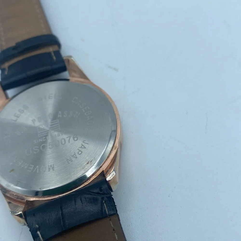 US Polo Assn rose gold tone wristwatch faux leather black band needs battery